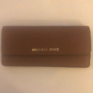 Michael Kors used wallet few spots on the front